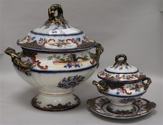 A Staffordshire pottery soup tureen and cover and another tureen and cover